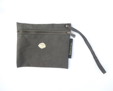 Load image into Gallery viewer, little pouch made of green canvas repaired with japanes kintsugi. The pouch has a copper zip and a string with button to fix on any bag with handles
