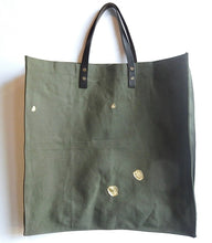 Load image into Gallery viewer, green canvas bag with kintsugi the bag has leather handles white background
